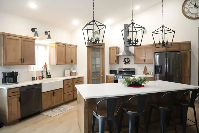 Hickory kitchen with black hardware and pendant lighting — built by Amish Heritage Woodworks, Wisconsin