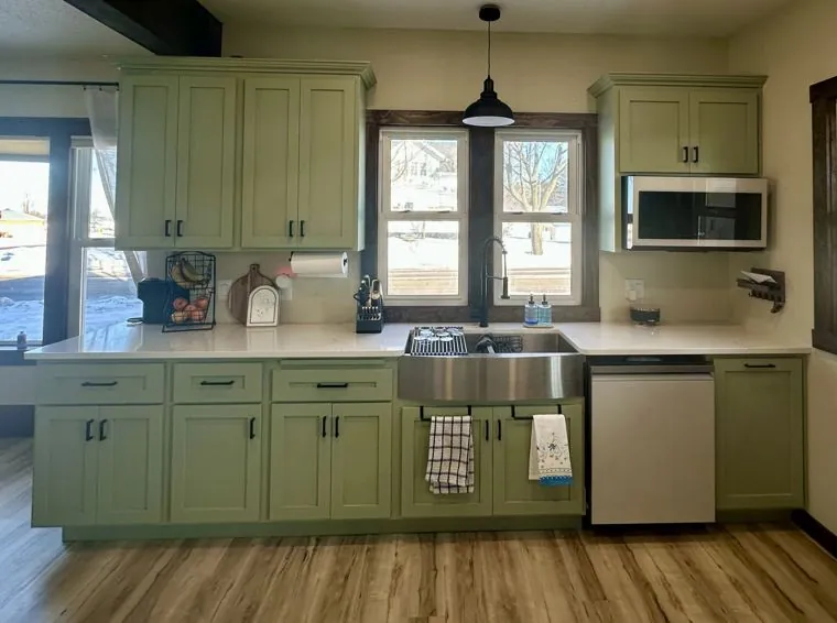 Painted maple perimeter cabinets under a beam ceiling — built by Amish Heritage Woodworks, Wisconsin